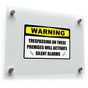 Warning: Trespassing Will Activate Silent Alarms Sign